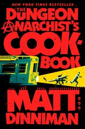 Book cover for "The Dungeon Anarchist's Cookbook" by Matt Dinniman. Bold red block letters spell out the title on a black background, with the "A" of Anarchist's drawn as an anarchy symbol; below, a yellow and teal subway car surges forward, its headlight beam picking out a running man and a cat, with a column of small red skull icons at right and "New York Times Bestseller" at the top.